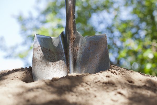 shovel in dirt new construction New England Wire Technologies